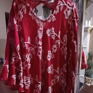 Beautiful red top with white embroidery design.  This runs a little big